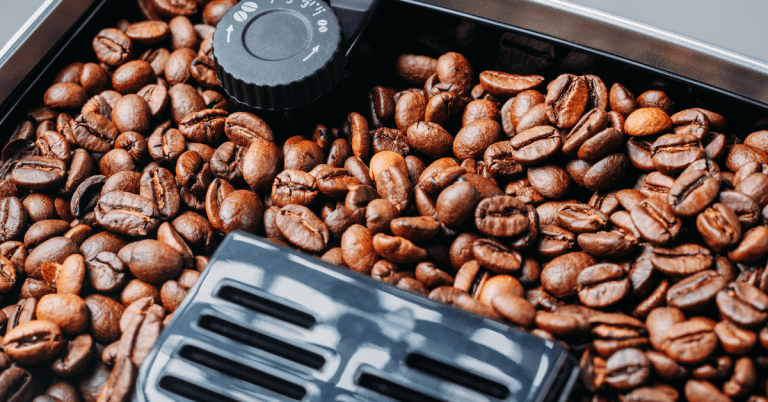coffee beans grinding in a coffee machine grinder