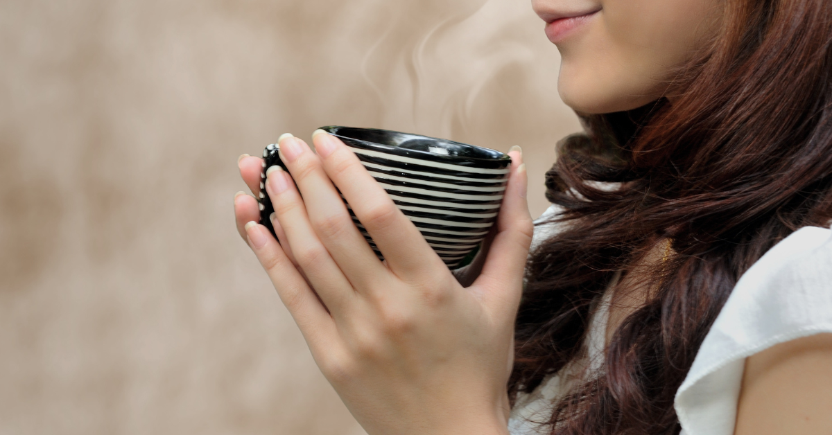 a woman drinking coffee