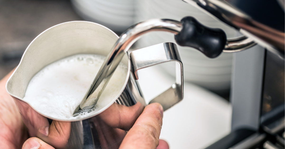 barista steaming milk