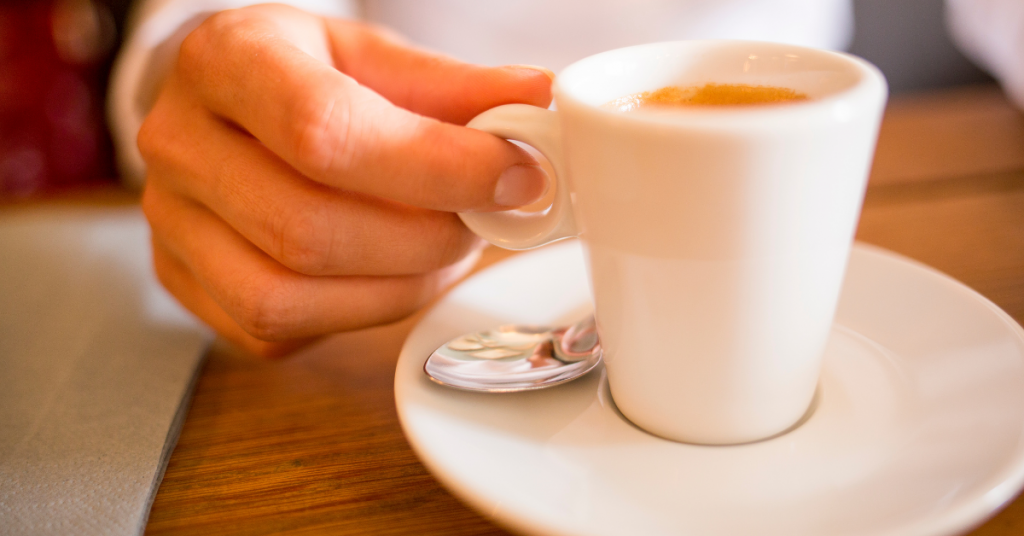 woman drinking espresso