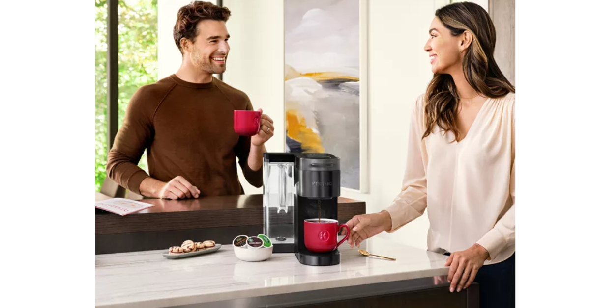 couple using keurig coffee maker