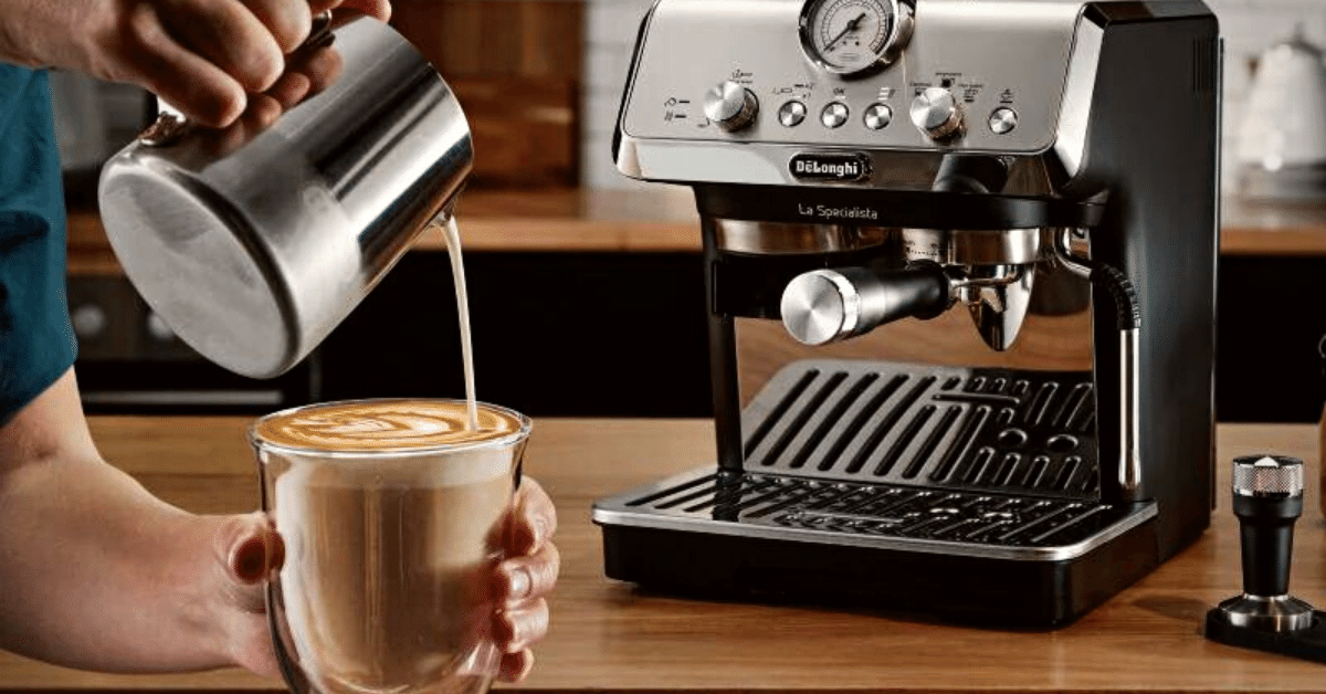 pouring milk in a drink prepared on delonghi espresso machine