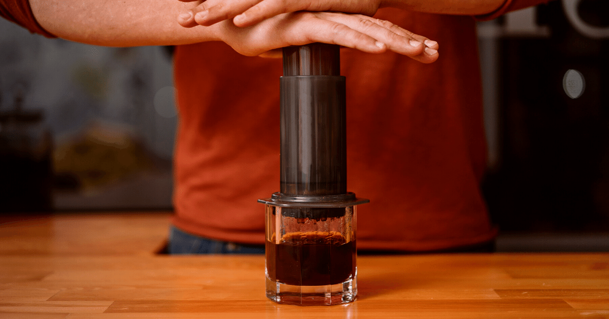 a person making cold brew in aeropress