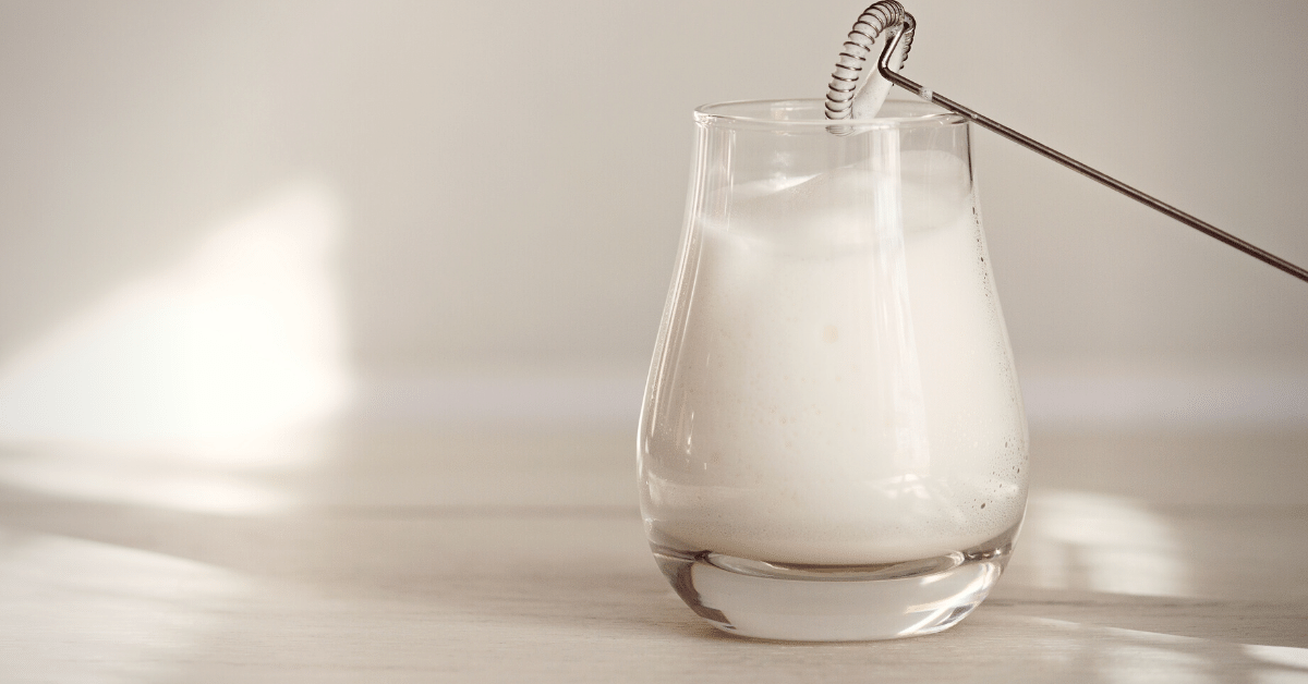 frothed milk in a glass