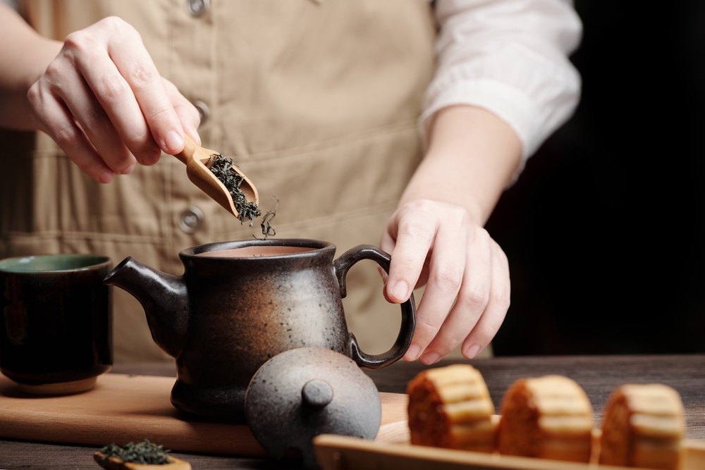 man preparing green tea