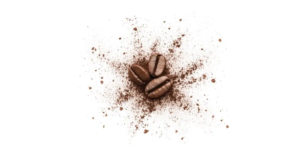 coffee beans with ground coffee underneath