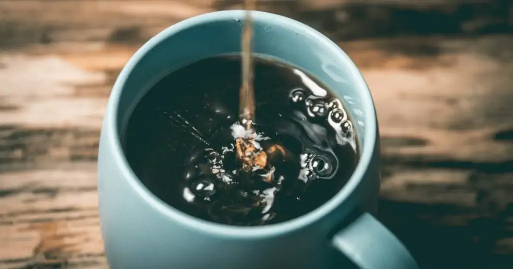 coffee being poured into a mug