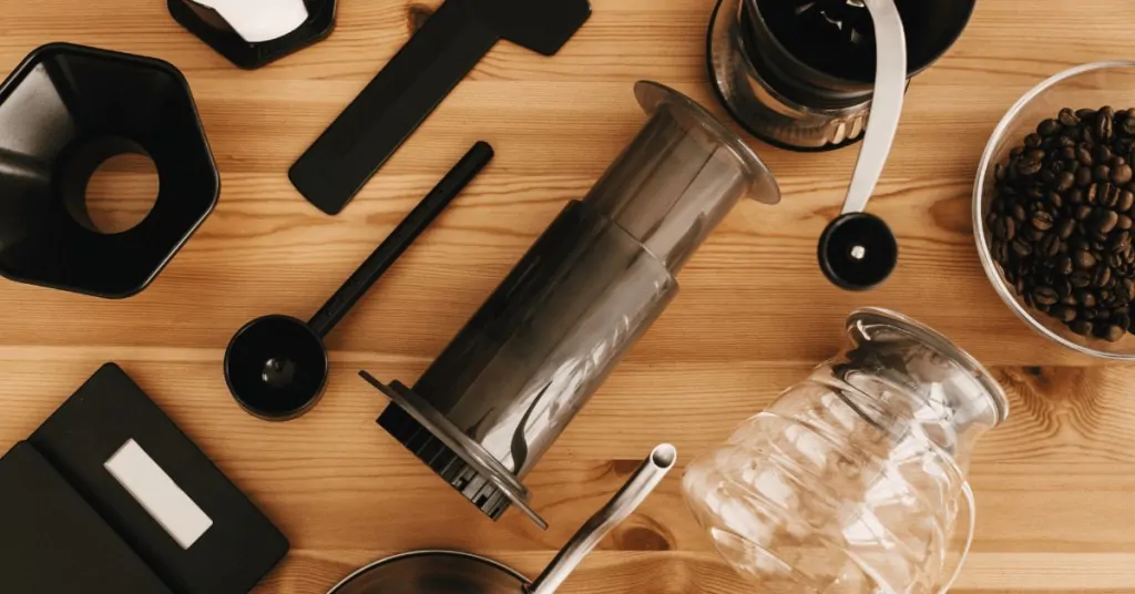 aeropress and additional equipment set out on a table