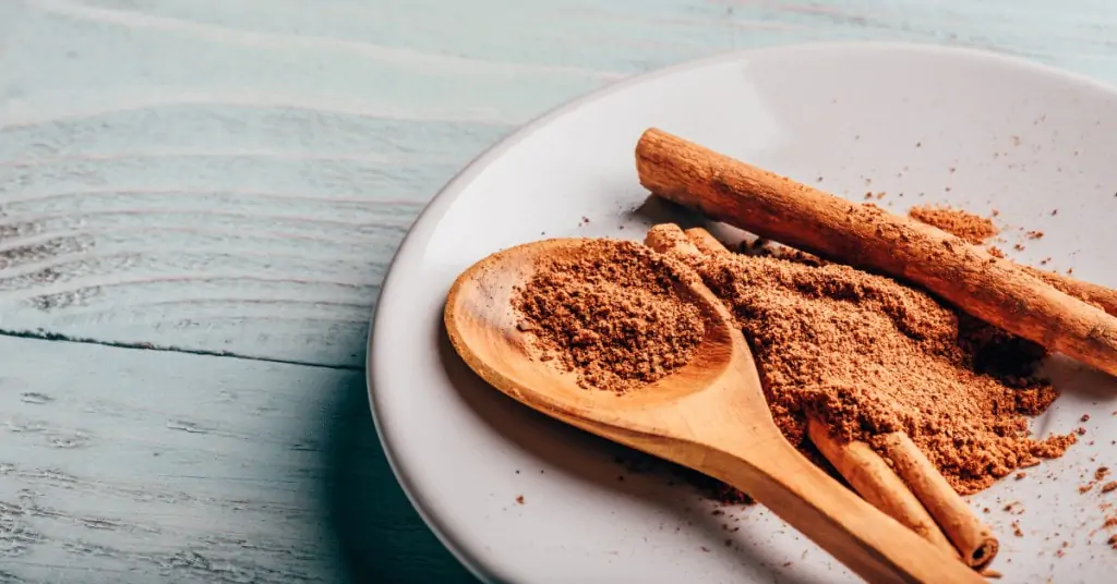cinnamon on a plate with a spoon