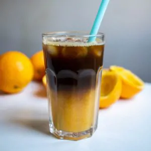 coffee and oj in a glass