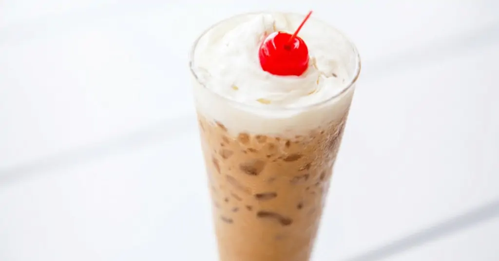 iced white chocolate mocha with a cherry on top
