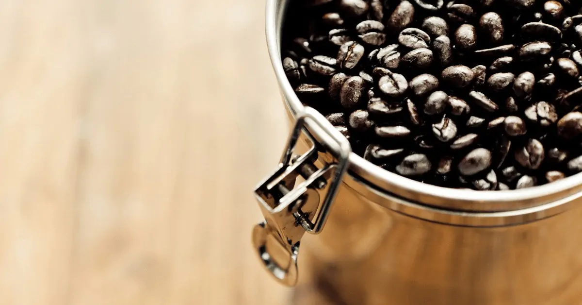 stainless steel coffee container with beans