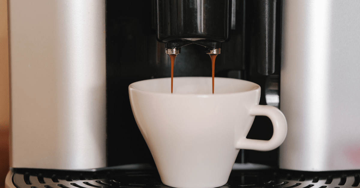 espresso pouring from coffee machine.