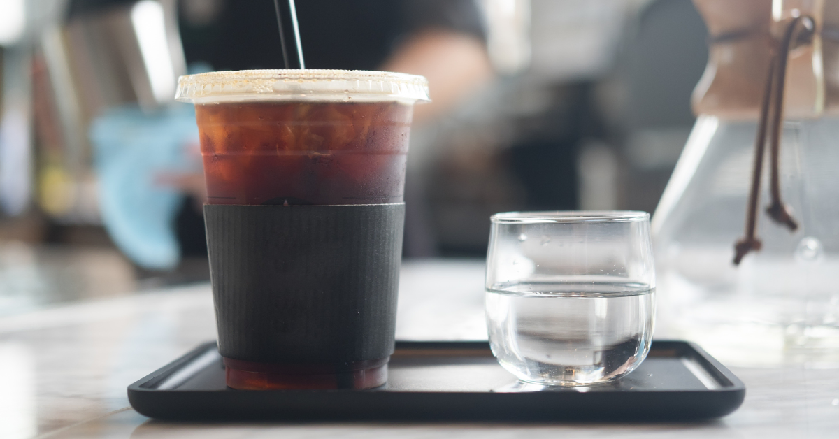 iced americano coffee served on black tray