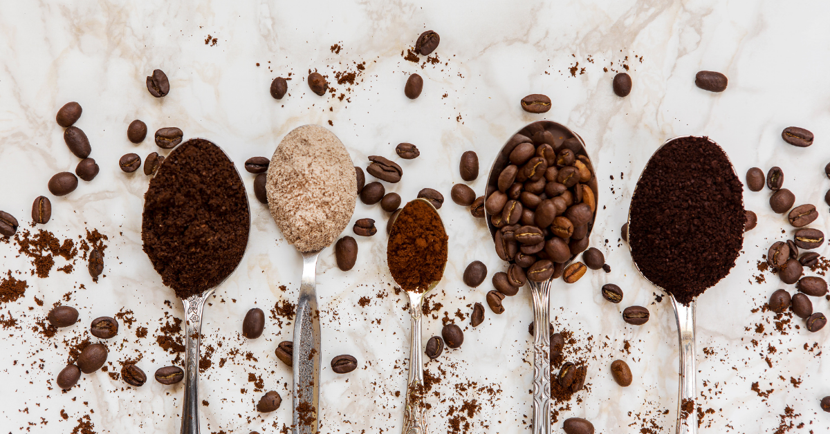 coffee beans and grind coffee in a coffee spoon