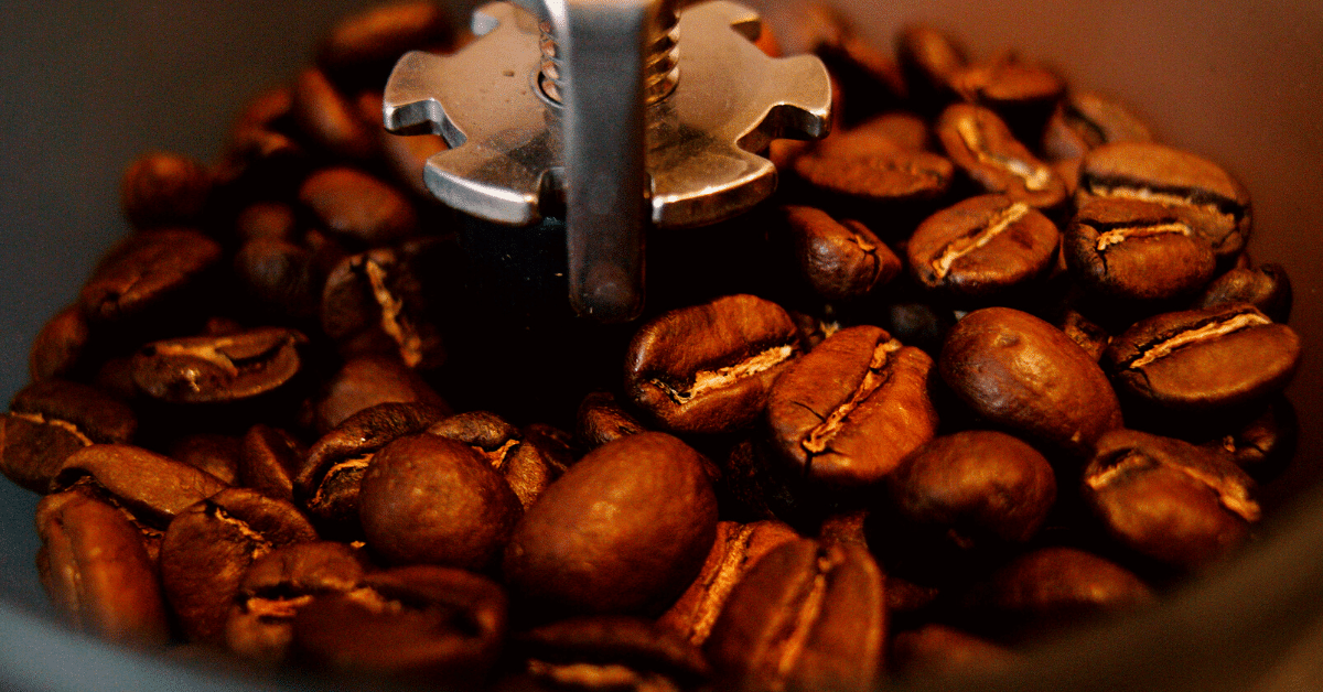 coffee beans in grinding machine