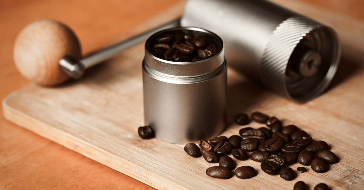 manual coffee grinder and dark roast coffee beans