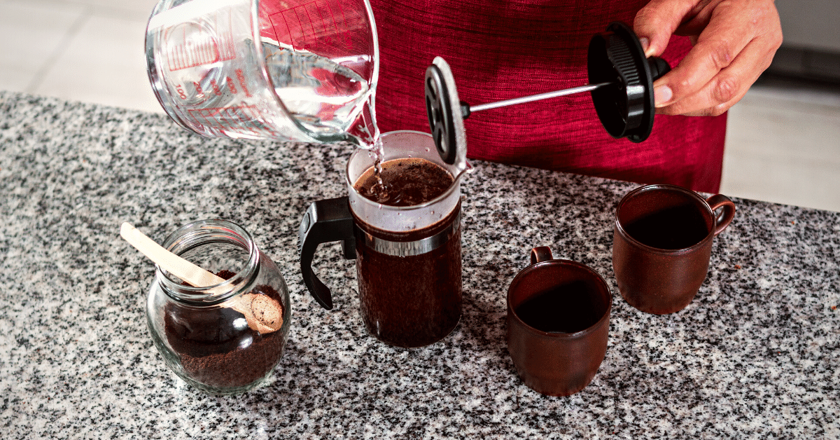 preparing coffee in a french press