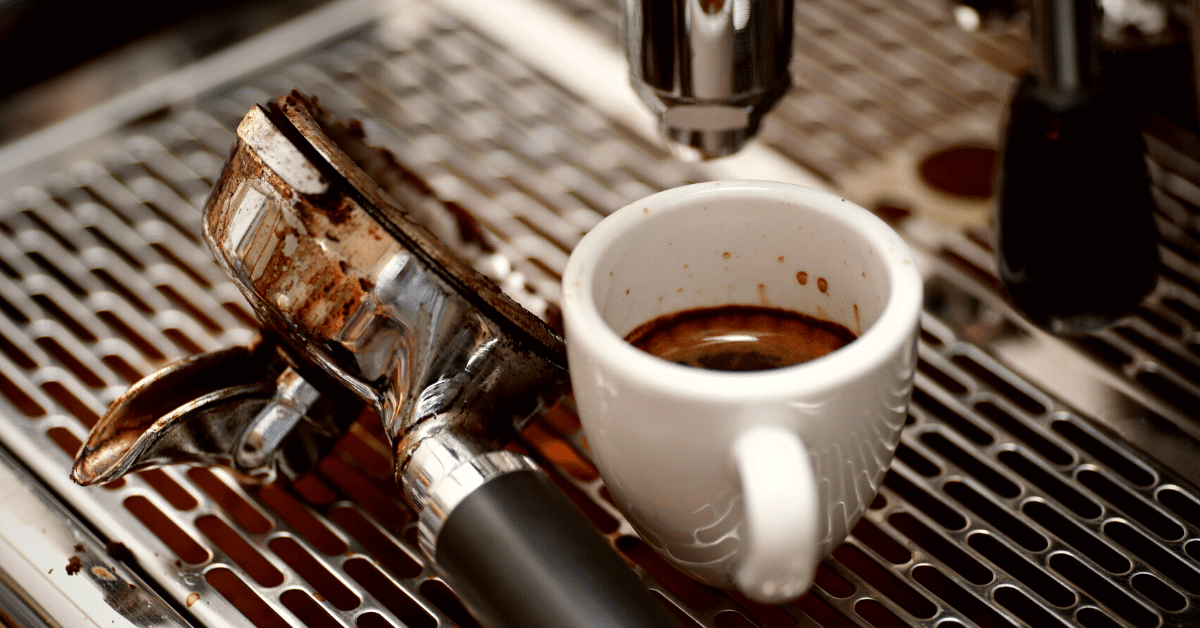 espresso cup under espresso machine
