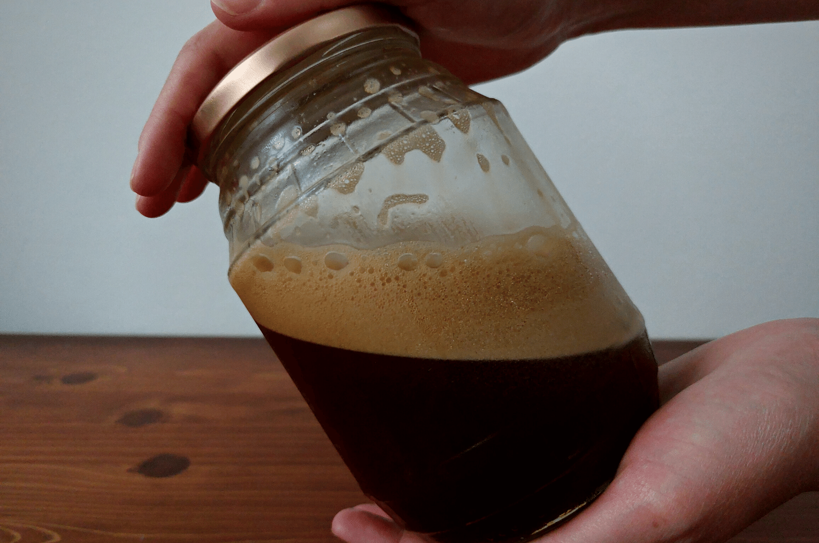 shaking espresso in a jar