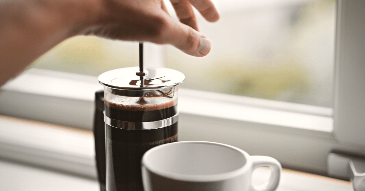 preparing coffee in a french press