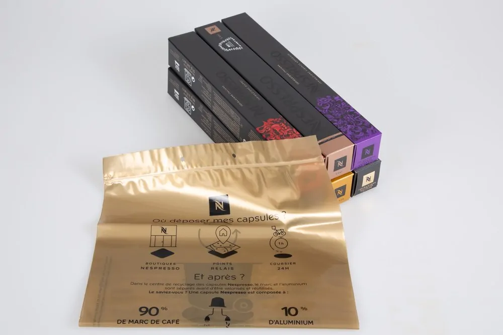 Nespresso golden recycling bag and box aluminum coffee capsules with logo brand and text sign